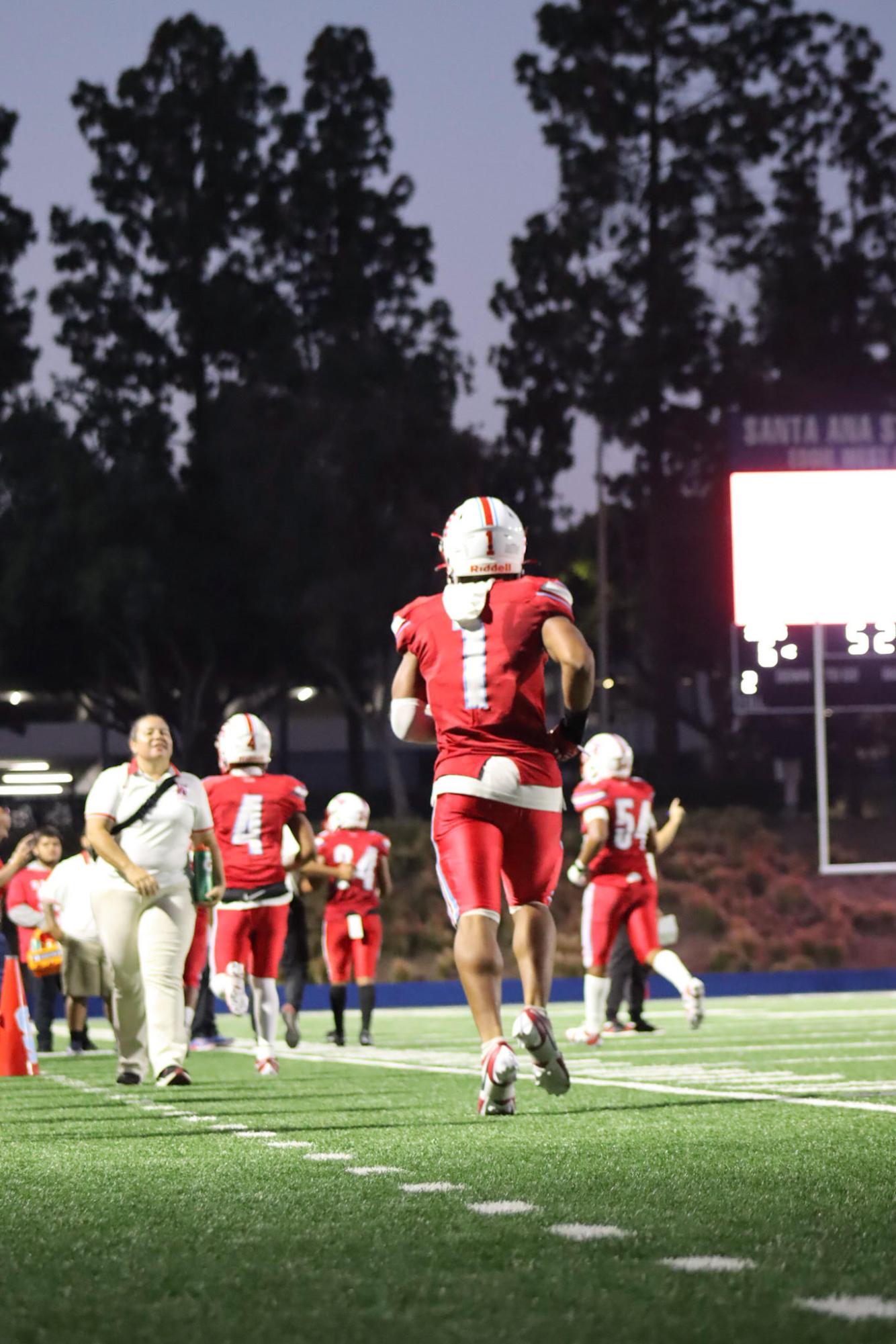 Senior Charles Hughes in the midst of a career night against St. Margarets. Santa Ana won the game 49-36 on Thursday, Sept. 14. 
