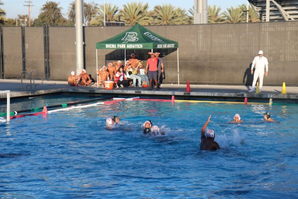 Santa Ana players jockey for position during a CIF-Southern Section Div. 4 matchup at Buena Park, October 31. The Saints won, 15-14, to advance to the quarterfinals. 